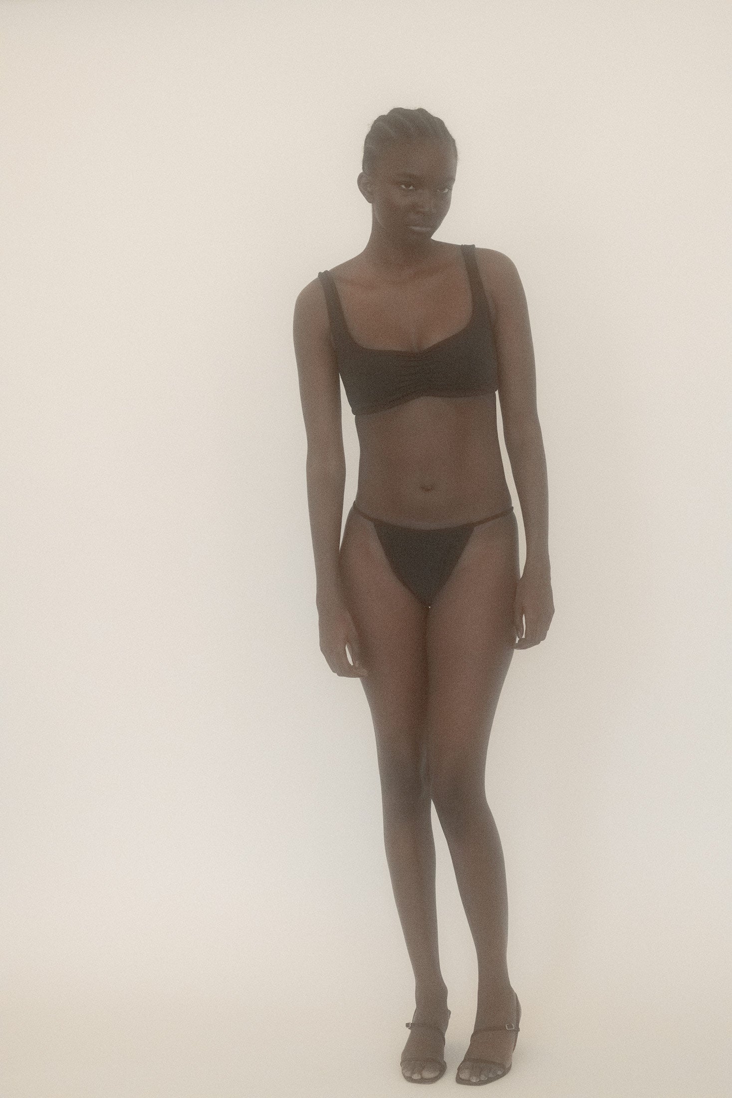 Belle the Label’s black swim top slides onto the scene like a blockbuster lead.