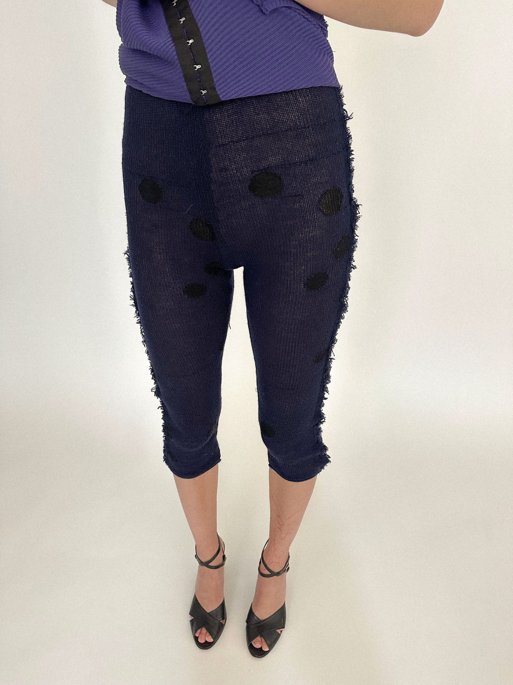 The form fitting silhouette holds tension in its simplicity - structured, exacting, quietly suggestive.