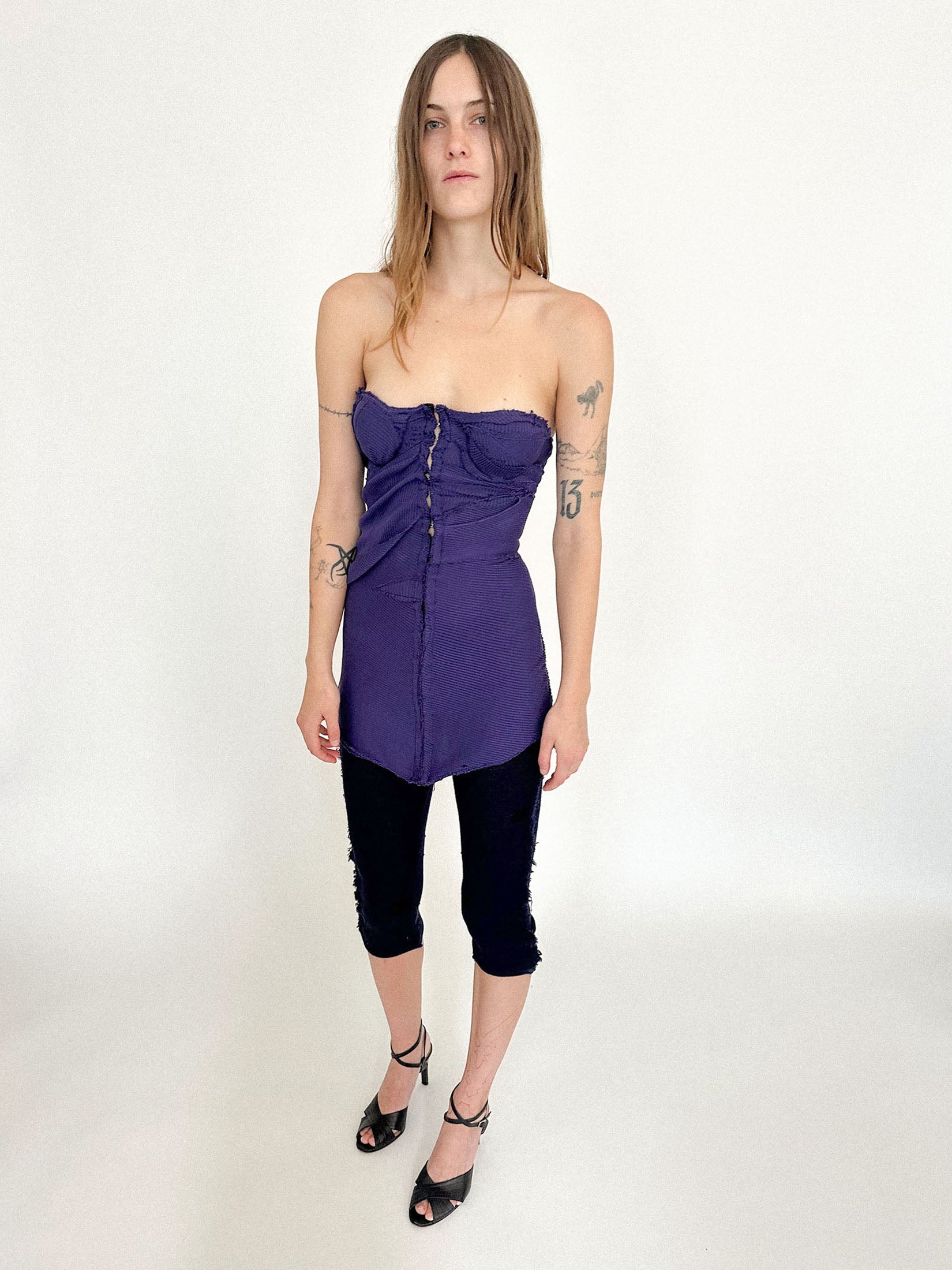 High-waisted knit capris by Talia Byre, cut close to the body in a navy knit scattered with subtle black polka dots.