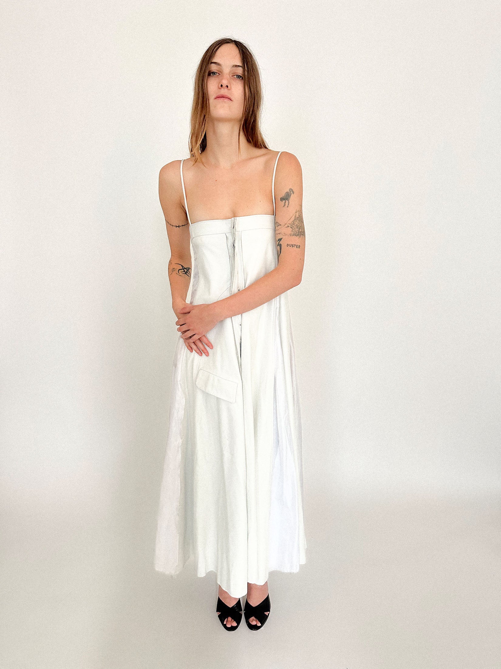 An ankle-length dress by Talia Byre, where leather meets silk in a negotiation of texture and control.