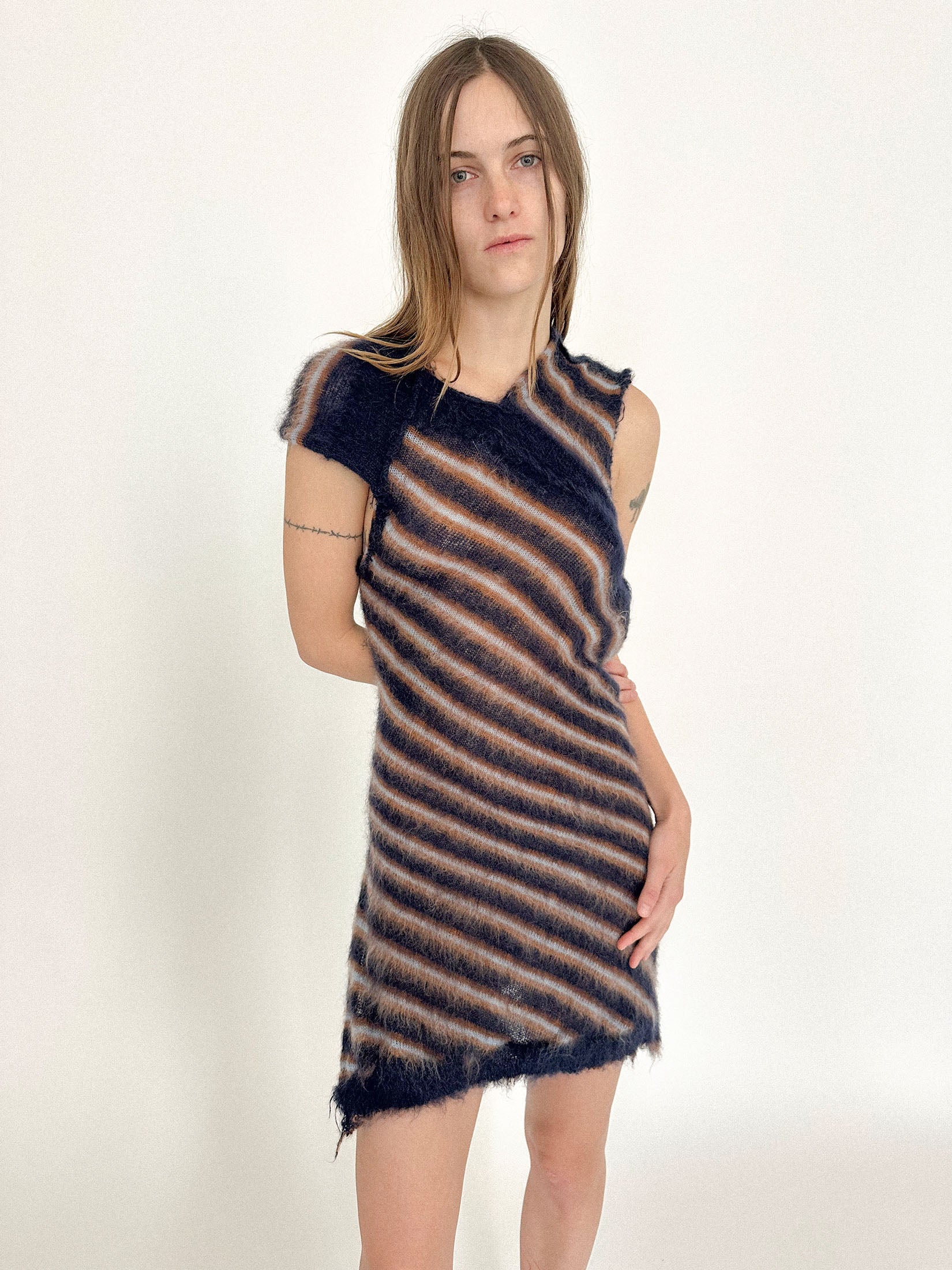 A knit dress by Talia Byre, where structure gives way to movement and the body does most of the talking.