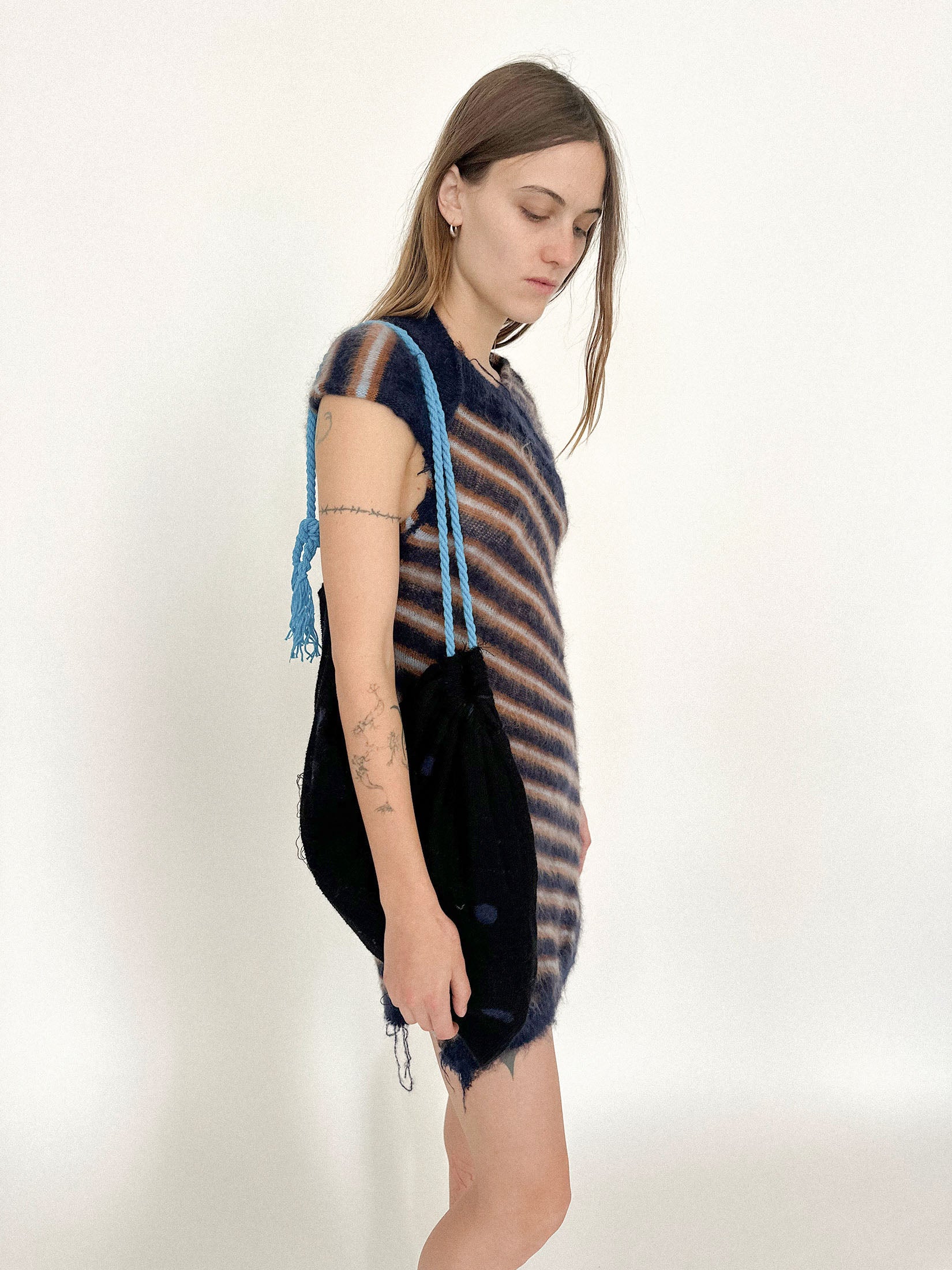 Tassel details add a flicker of movement, like punctuation.