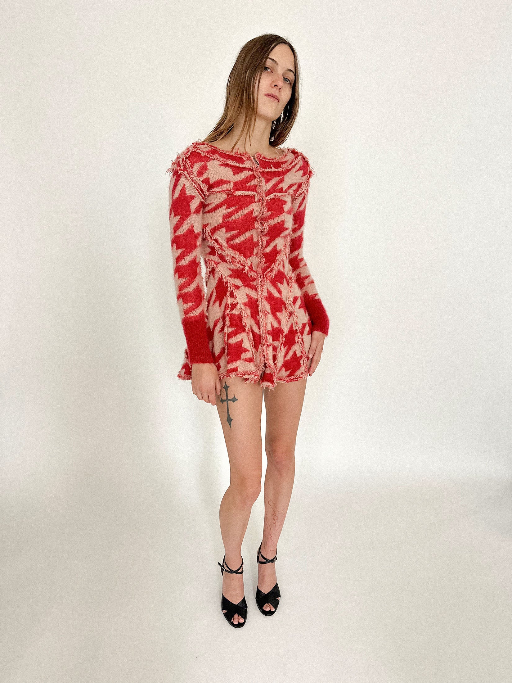 The silhouette clings just enough to suggest its slim, deliberate, almost architectural structure.