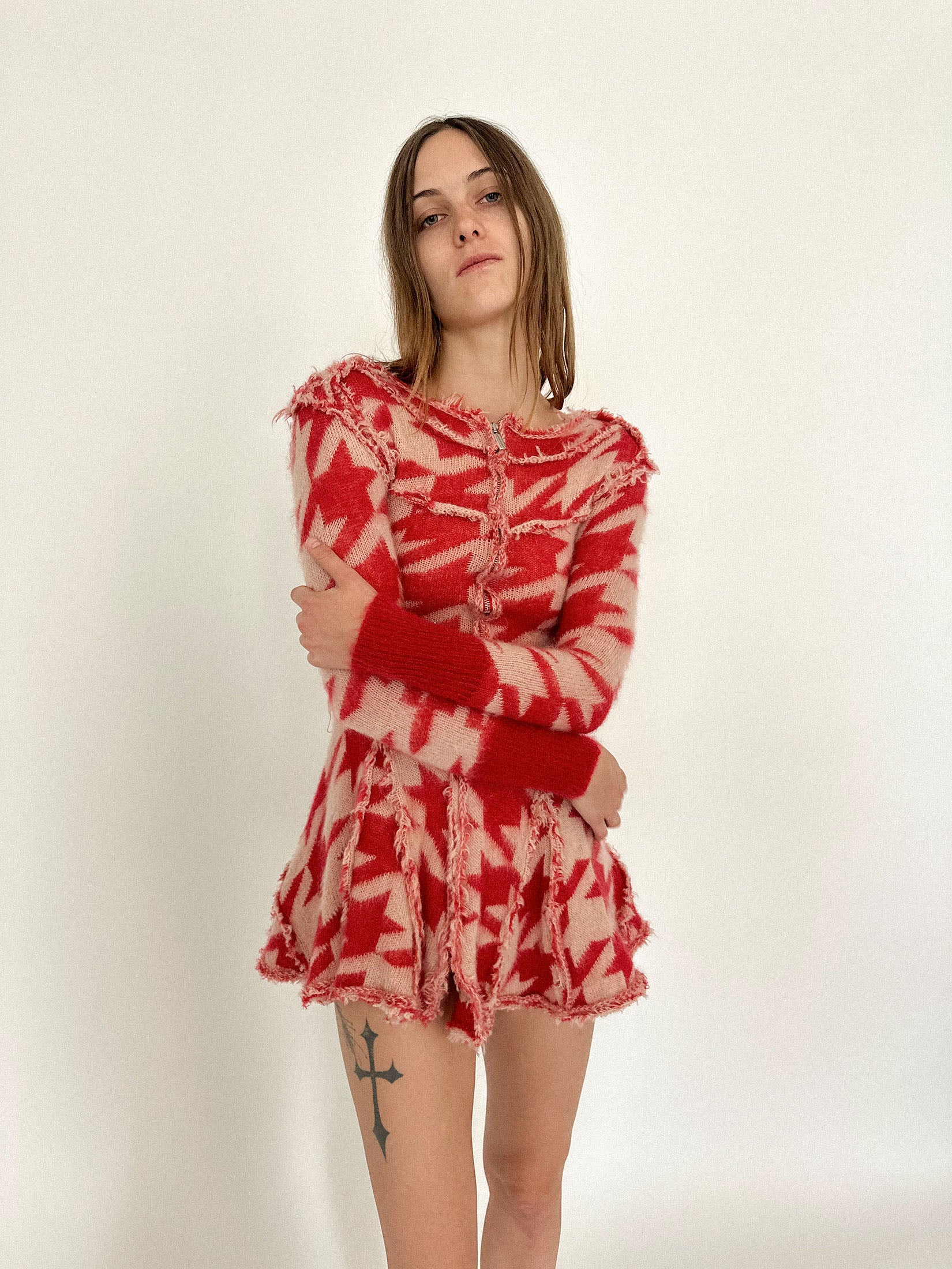 An exposed front zip runs the length of the body, an invitation to decide just how much to reveal.