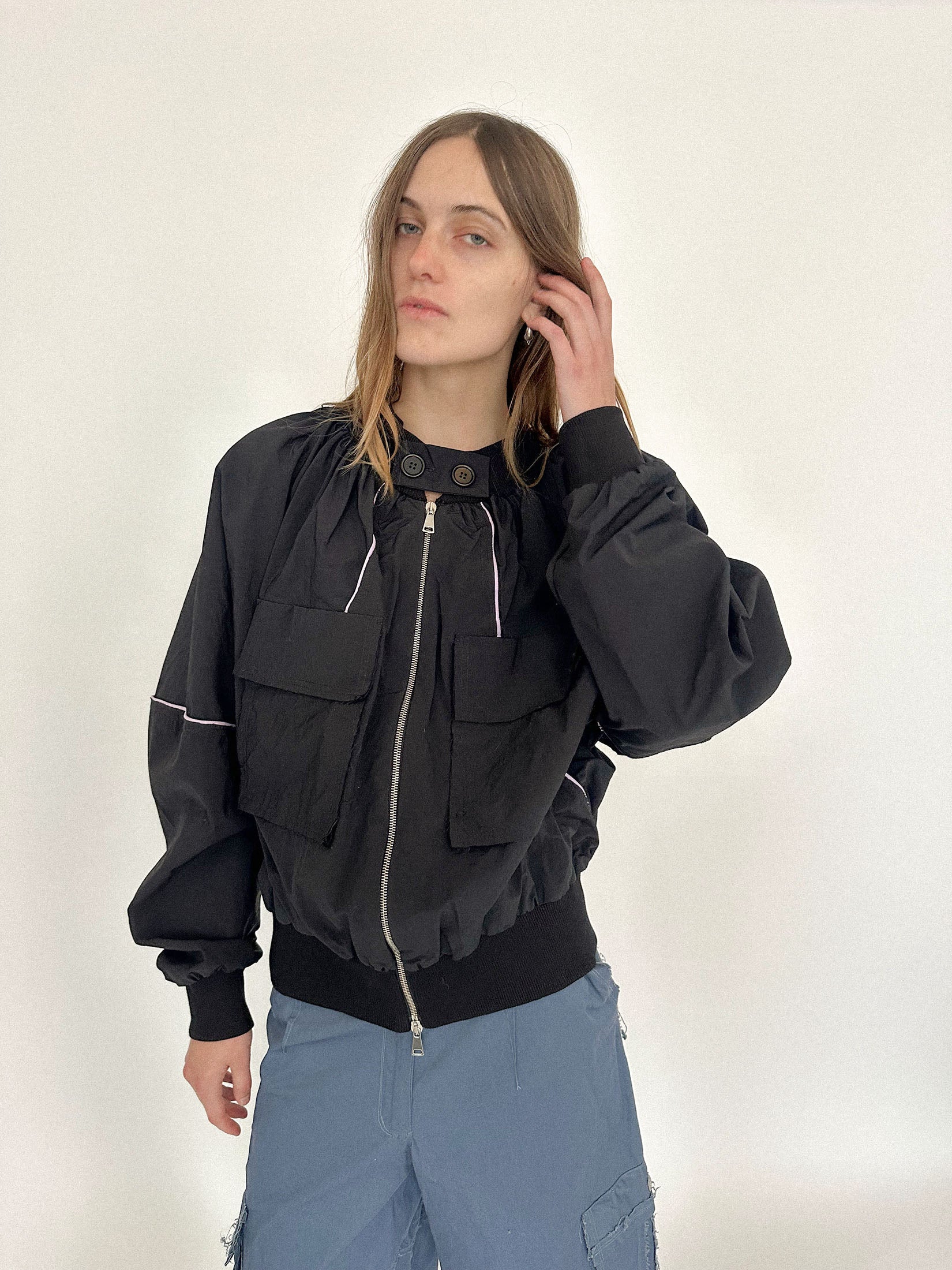 Balloon sleeves lend it volume and intent, the kind that reshapes a silhouette without asking permission.