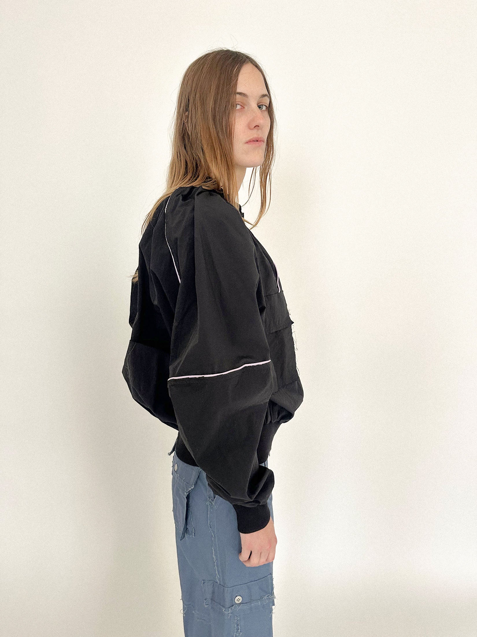 Made in Italy from 100% black nylon, it feels cinematic in motion. Part utility, part seduction.