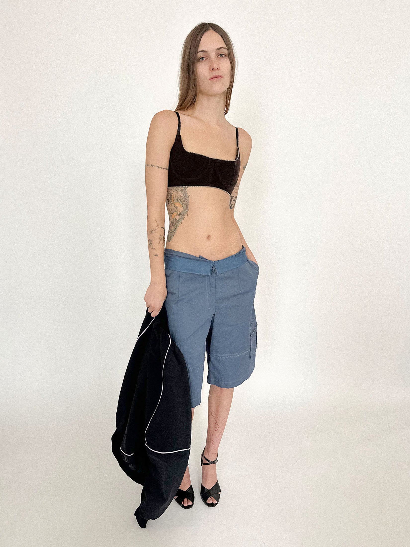 Thin adjustable straps and a hook-and-eye back closure give it structure, while underwired cups promise precision beneath the softness.