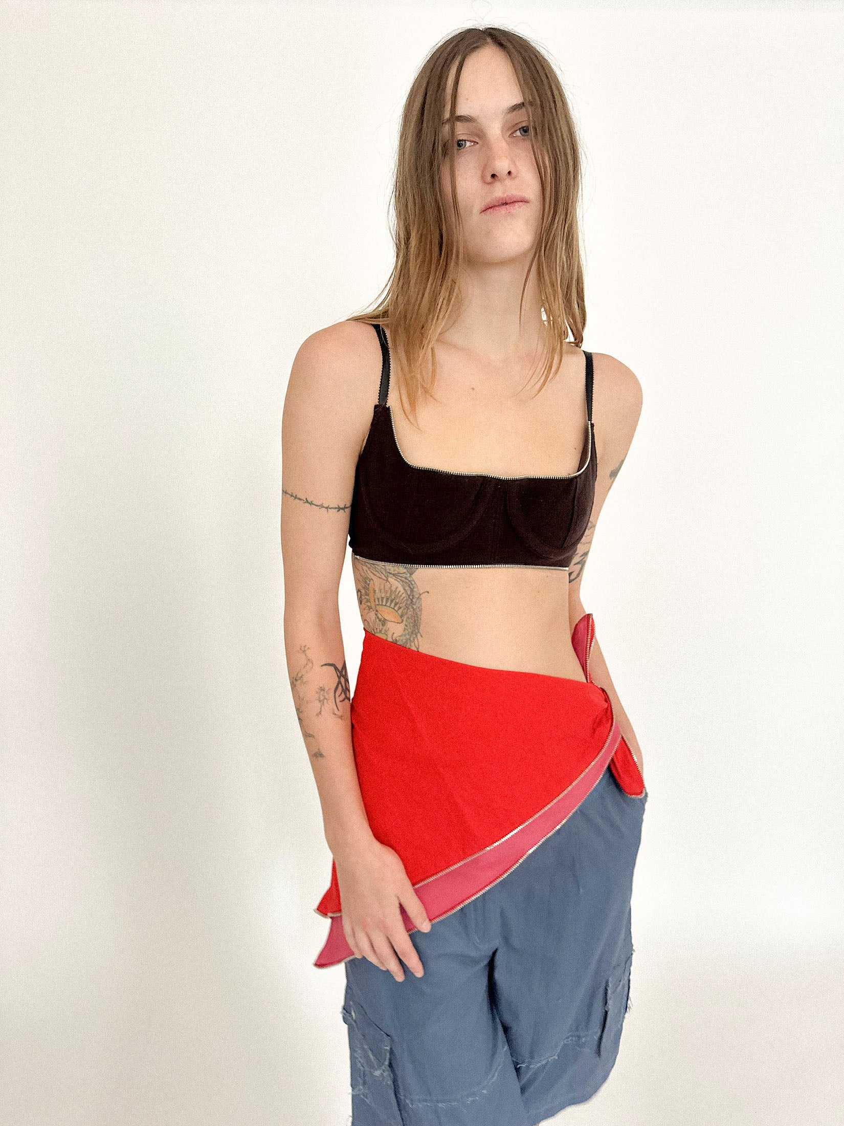 A scarf by Talia Byre, designed with a zipper running the edge. Part embellishment, part disruption.