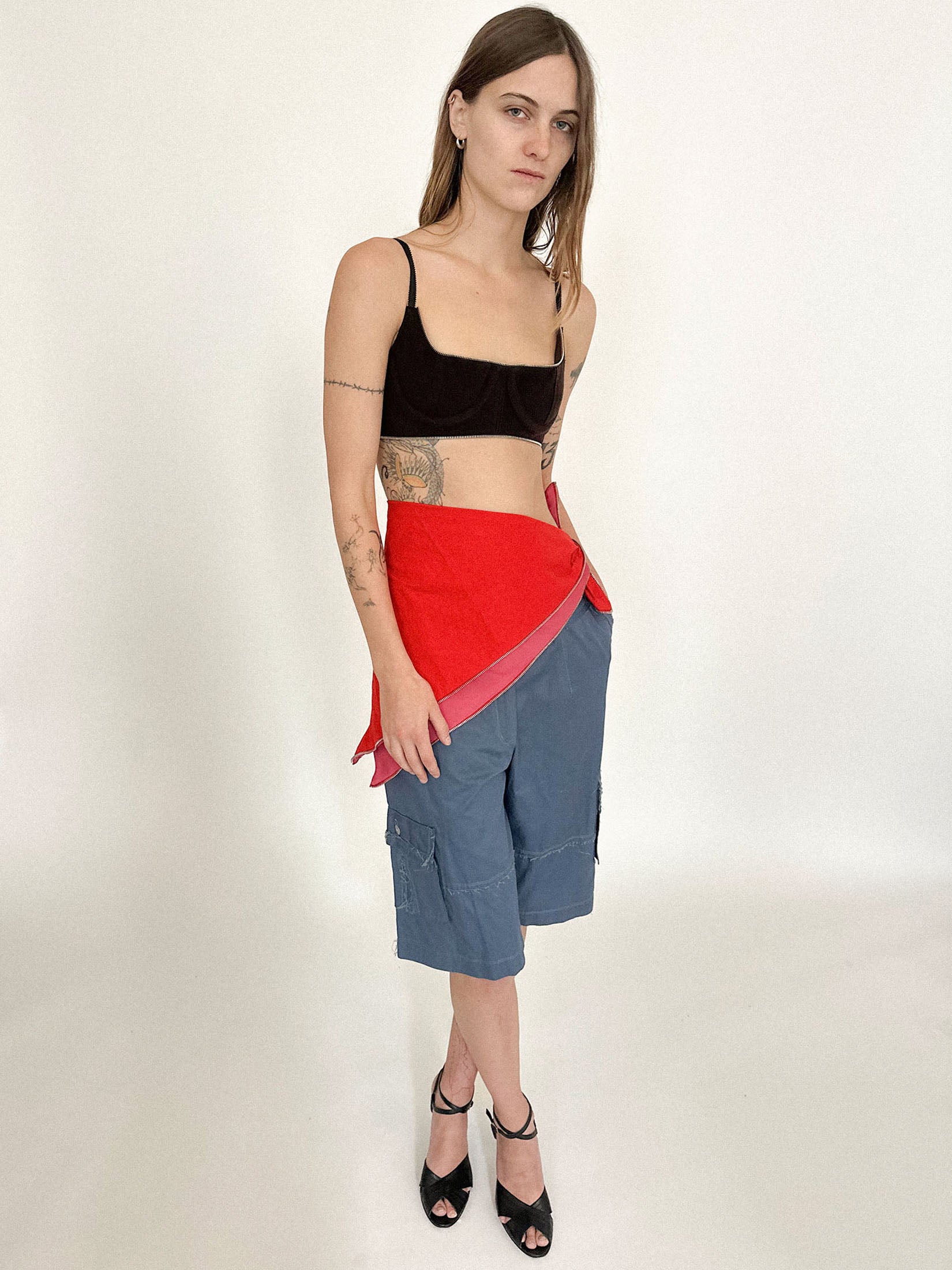 The scale invites interpretation: wear it wrapped, draped, twisted, or tied.