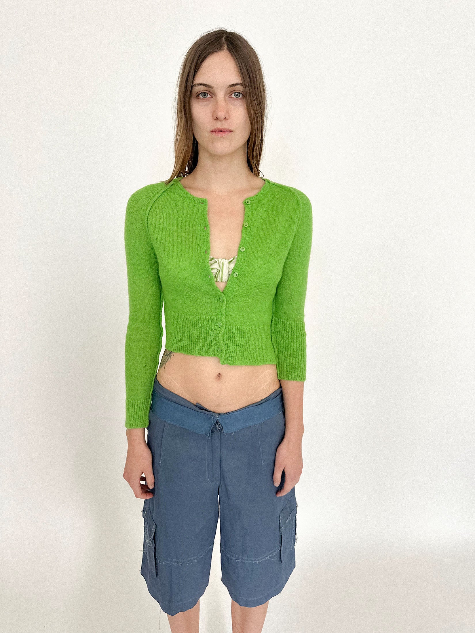 Asymmetrical sleeves and an uneven hem give it the feeling of movement, like it’s mid-transformation.