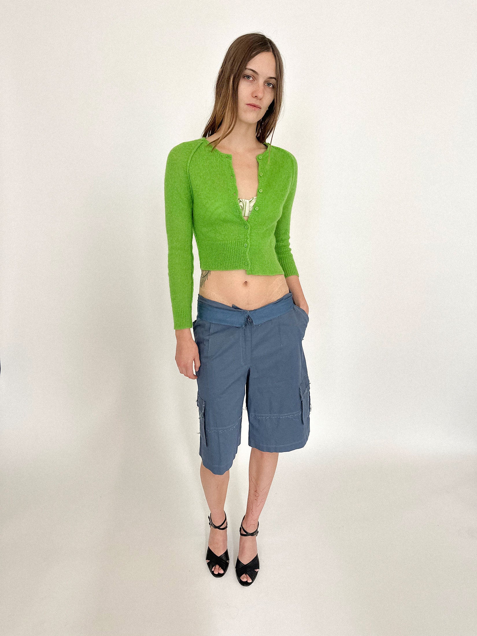 The high neck and shrunken fit keep things contained, but only just.