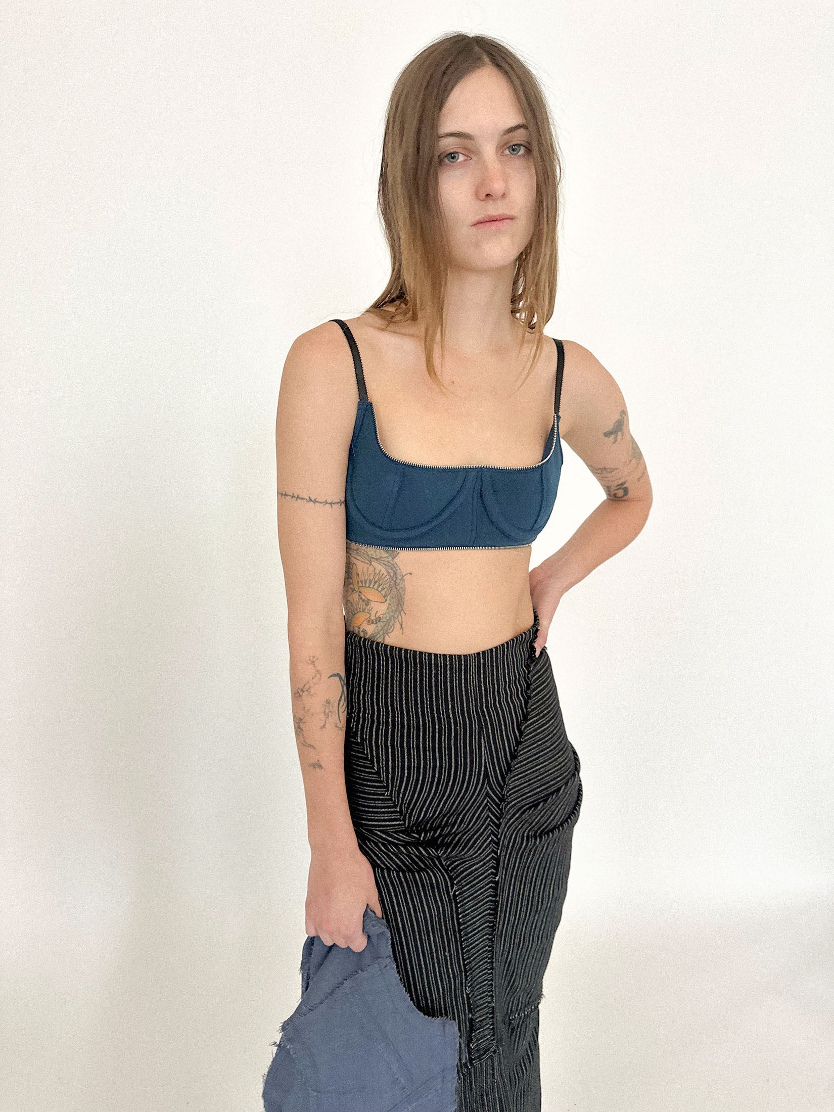 A one of a kind sample, it feels more like a scene than a garment: composed, charged, unforgettable.