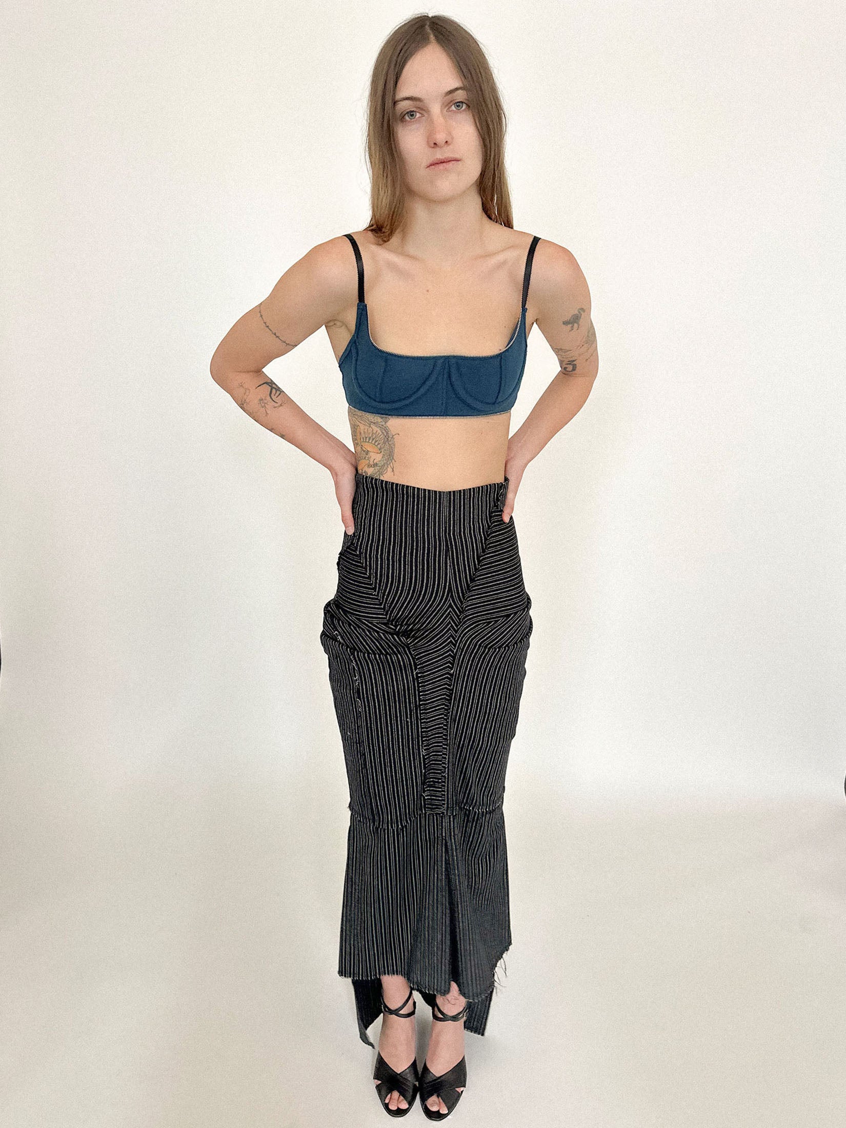 The high waist defines the frame, while subtle gathering throughout adds a sense of movement.