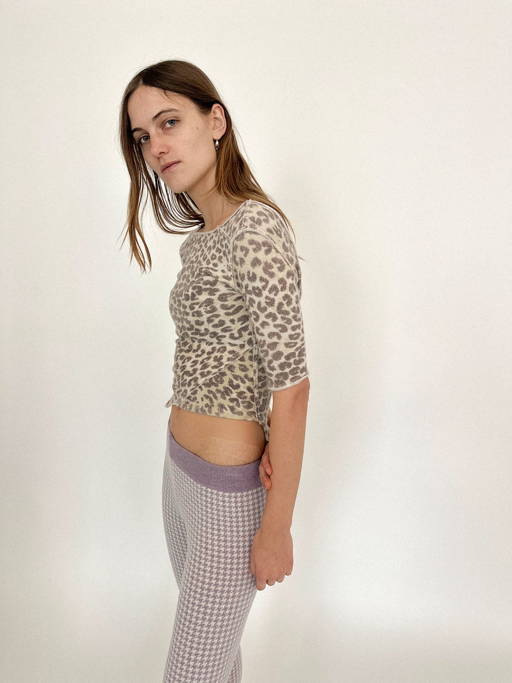 Exposed seams run like fault lines, intentional and imperfect, tracing where structure meets instinct.