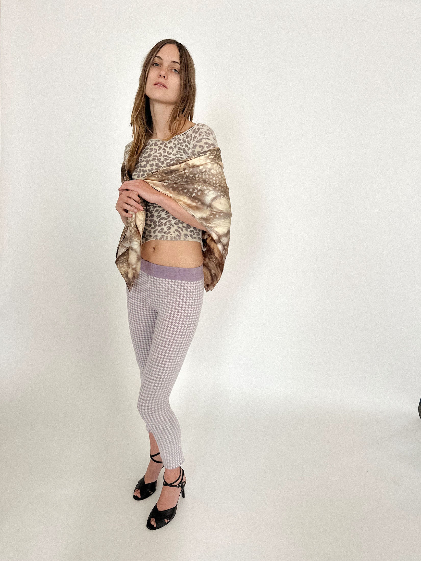 A silk scarf by Talia Byre, printed with a deer motif that feels mythic, like something pulled from a dream half-remembered.