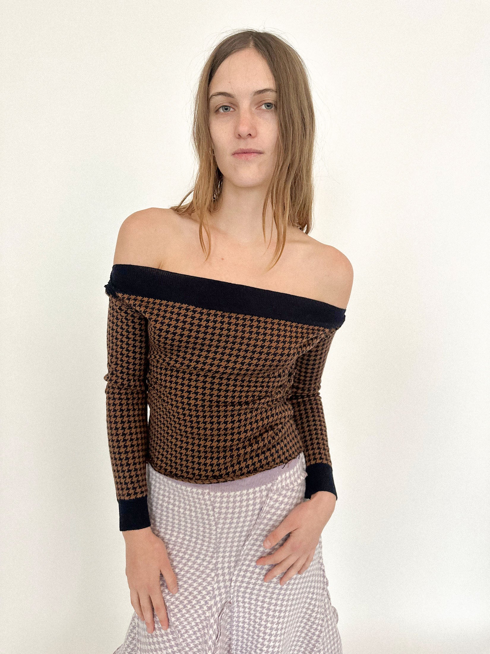 An off-the-shoulder knit top by Talia Byre, cut to toe the line between elegance and exposure.