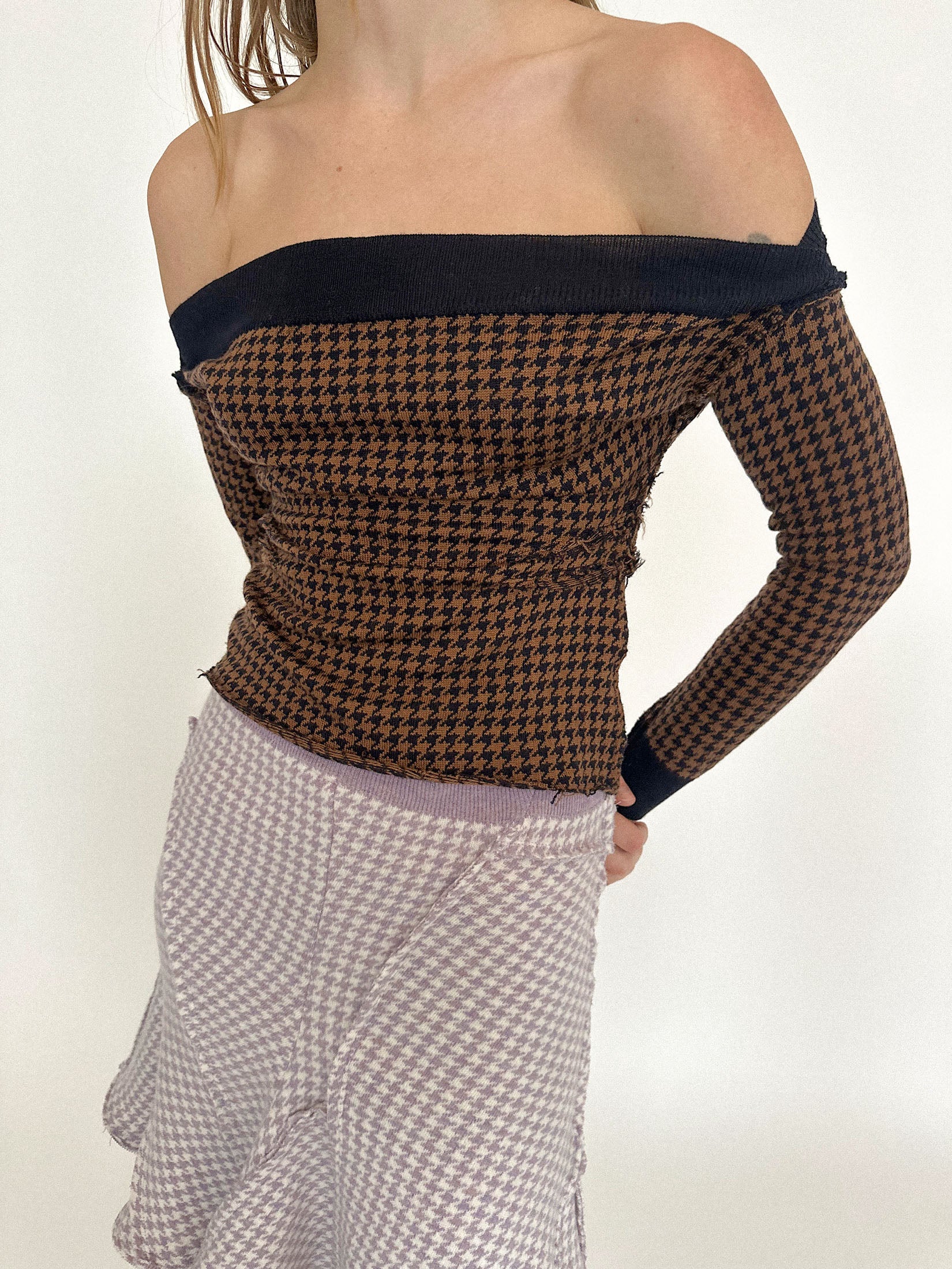 An elasticated waist holds it in place, while exposed patchwork seams trace across the surface like a map of its making.