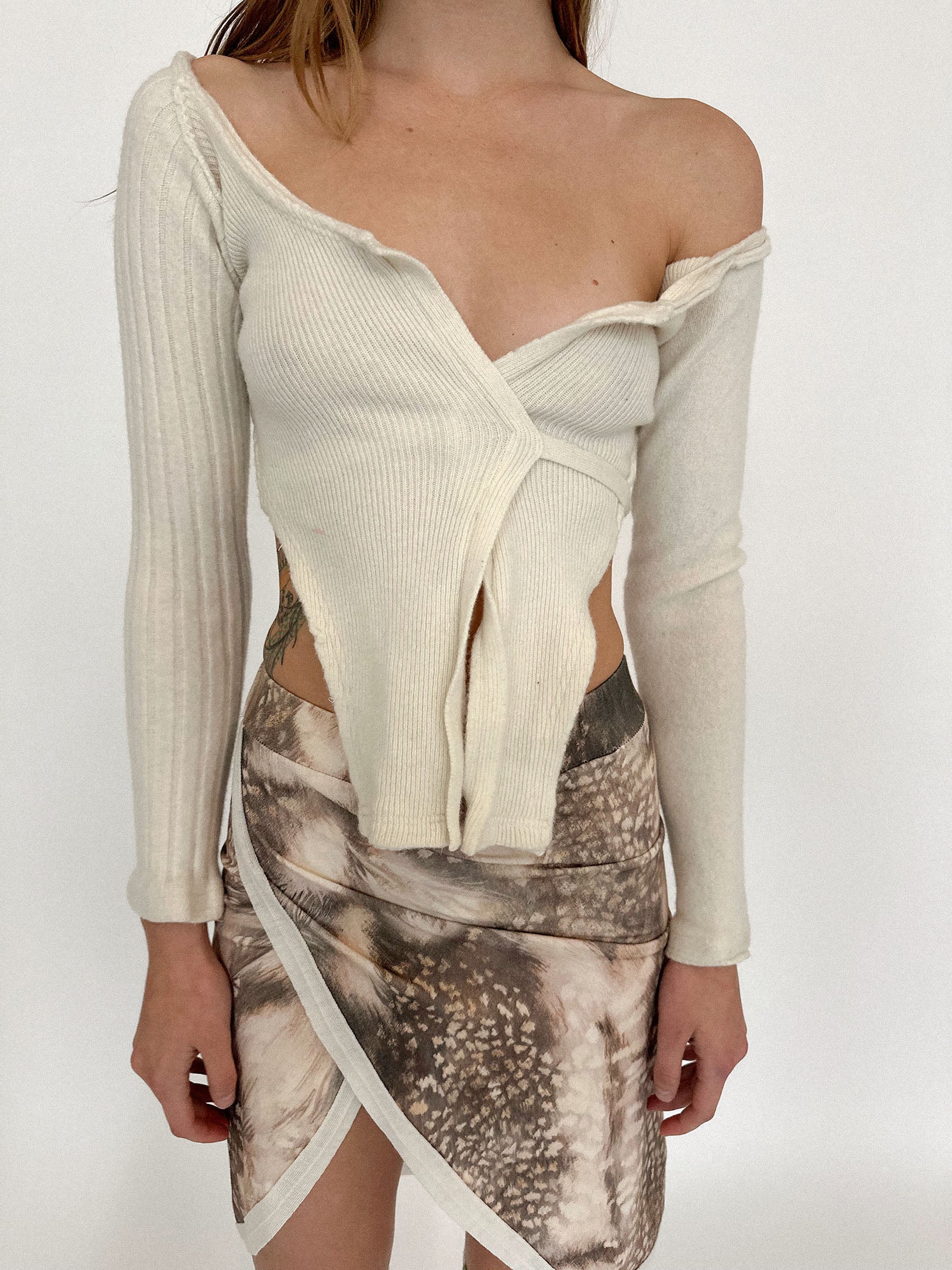 The ribbed texture lends it subtle structure, tracing the form without clinging too close.