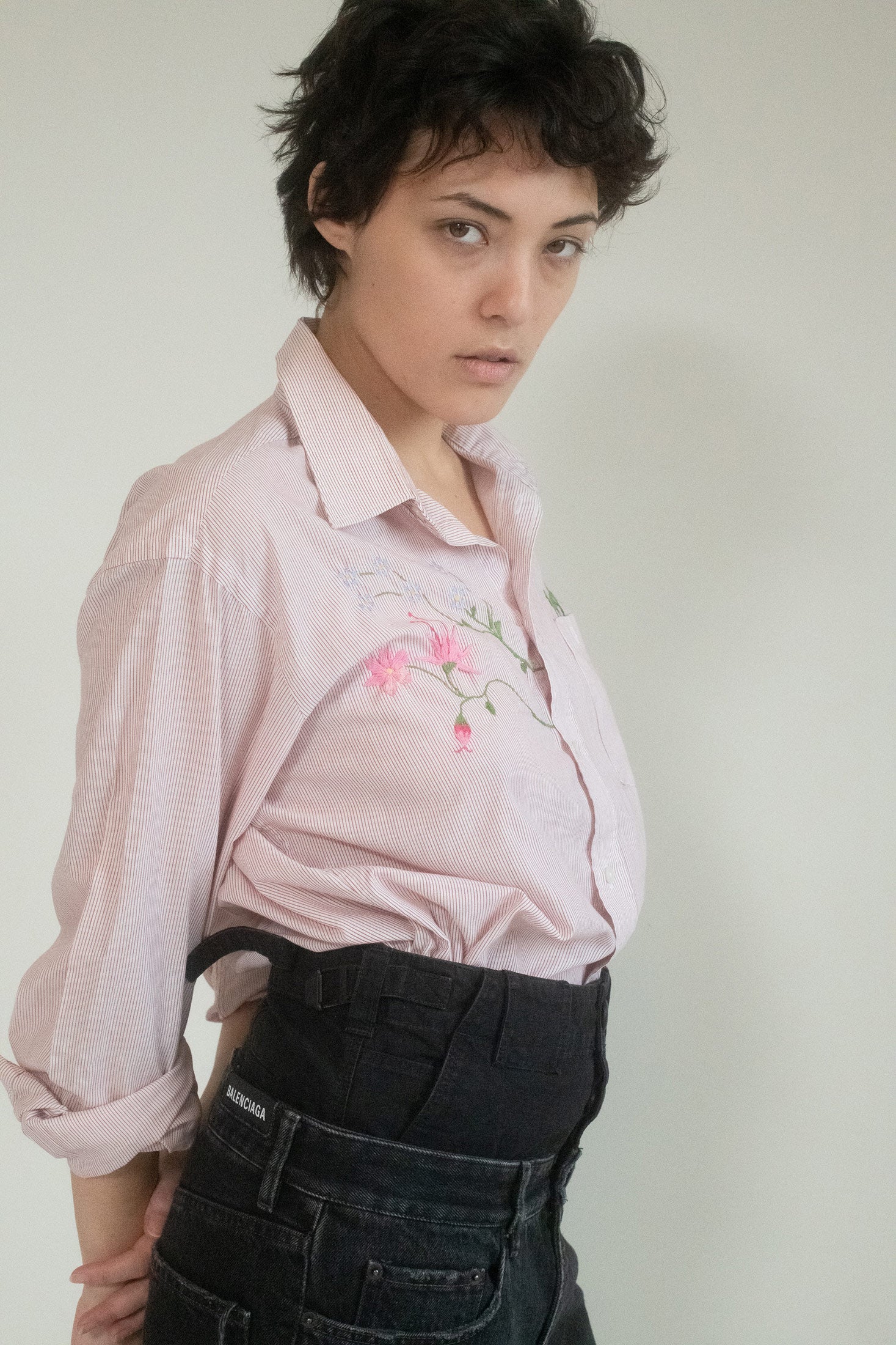 This is not just a shirt; this is a canvas—a unique expression of femininity, chic in its precision but never rigid. 