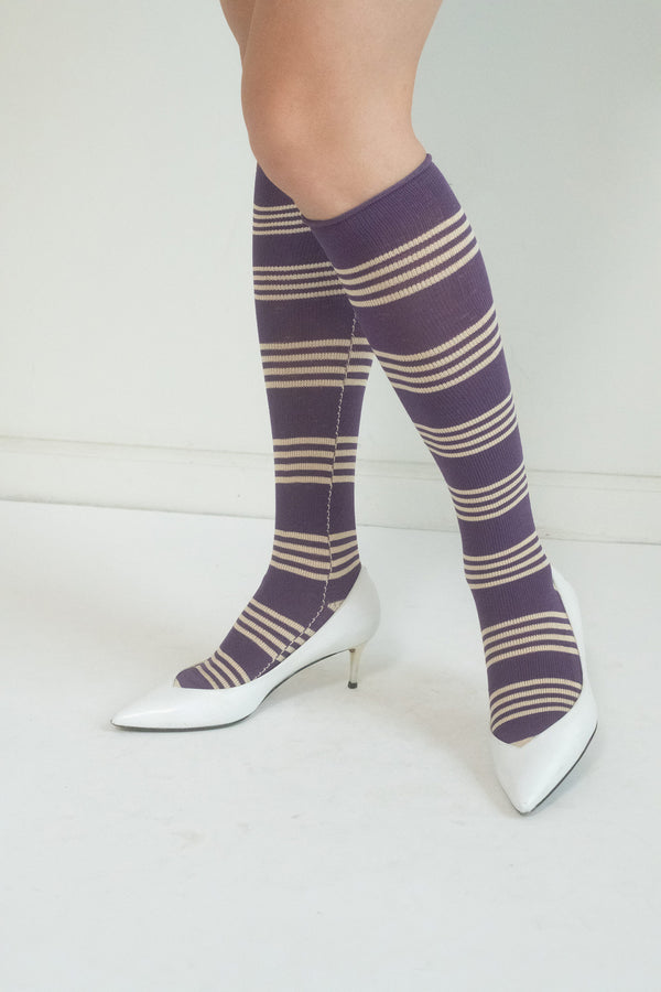 From Chloë Sevigny's personal archive, these striped purple knee-high socks are a playful yet practical nod to effortless style. 