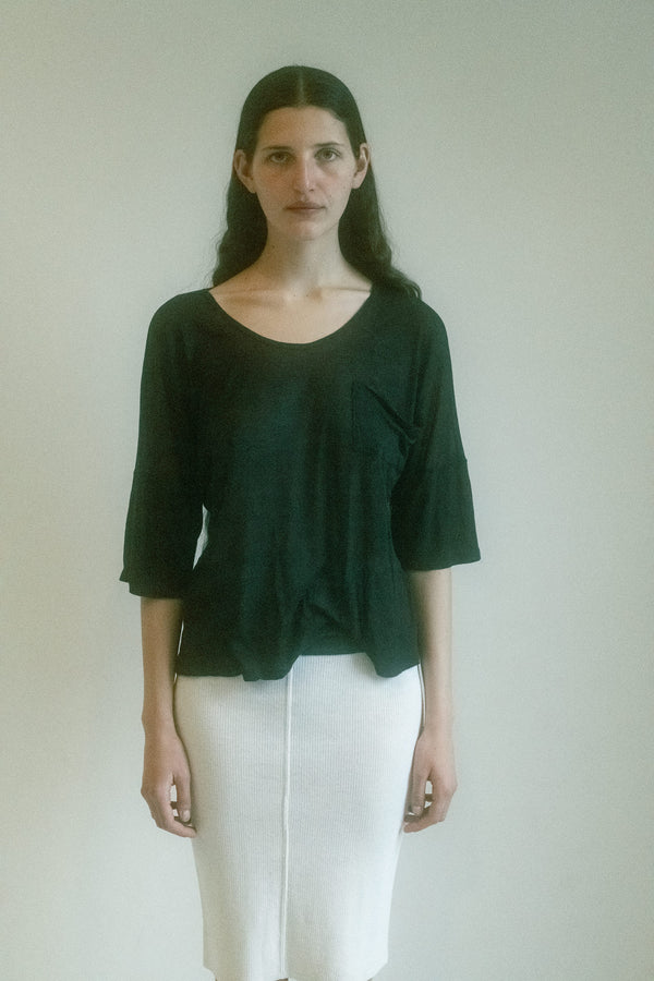 From the personal archive of Jade Lai, this boxy tee redefines casual elegance with an effortless ease that lingers in the mind. 
