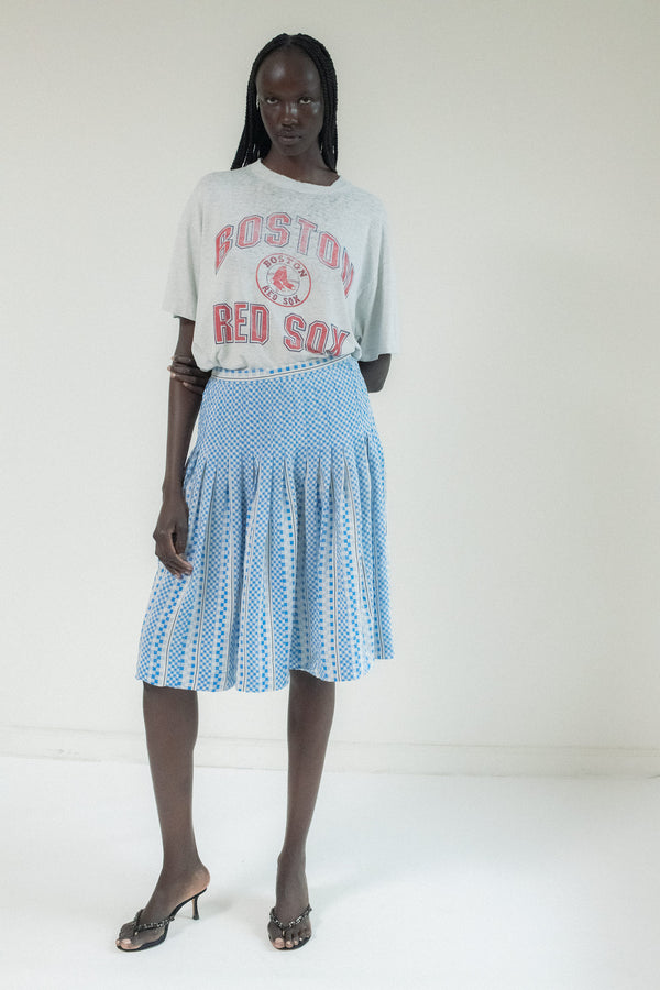 Step into timeless elegance with this Vintage Pleated Skirt—a stunning expression of movement, pattern, and poise.