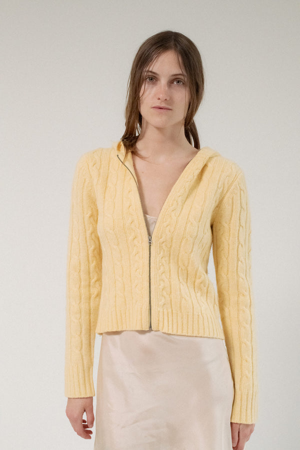 Radiating warmth and effortless style, the Abercrombie & Fitch Cable Knit Zip-Up in soft yellow is a celebration of timeless elegance with a playful twist.