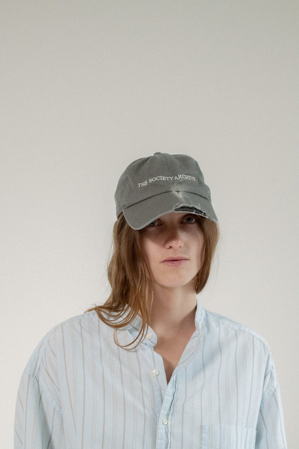Discover the balance between classic style and modern edge with The Society Archive Distressed Baseball Cap in dark grey.