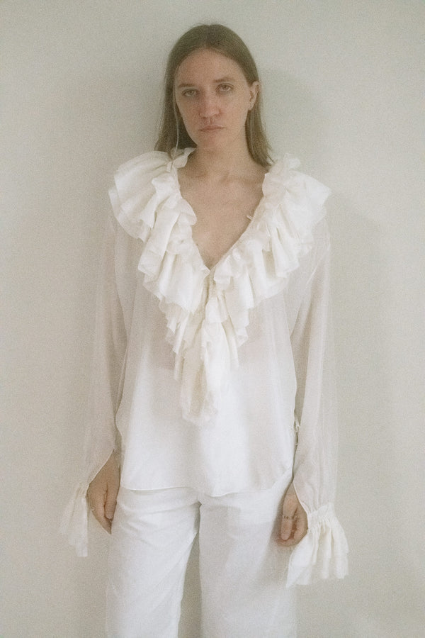 From Judy Turner’s New York studio comes a blouse that doesn’t just enter a room—it drifts in. 
