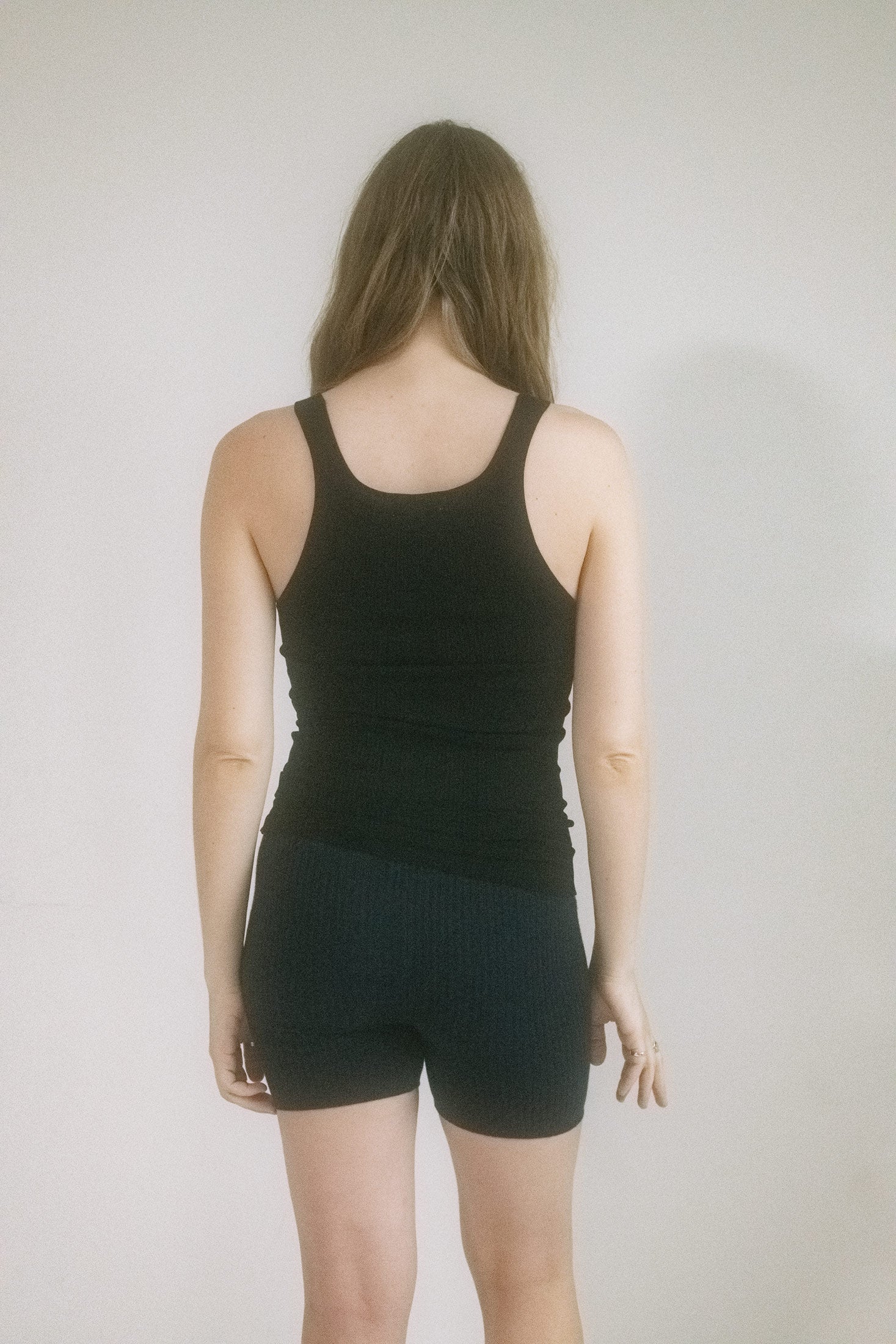 Cut mid-waist in a deep navy hue with an elasticated band that holds without gripping, they’re the kind of staple that slinks between utility and allure. 