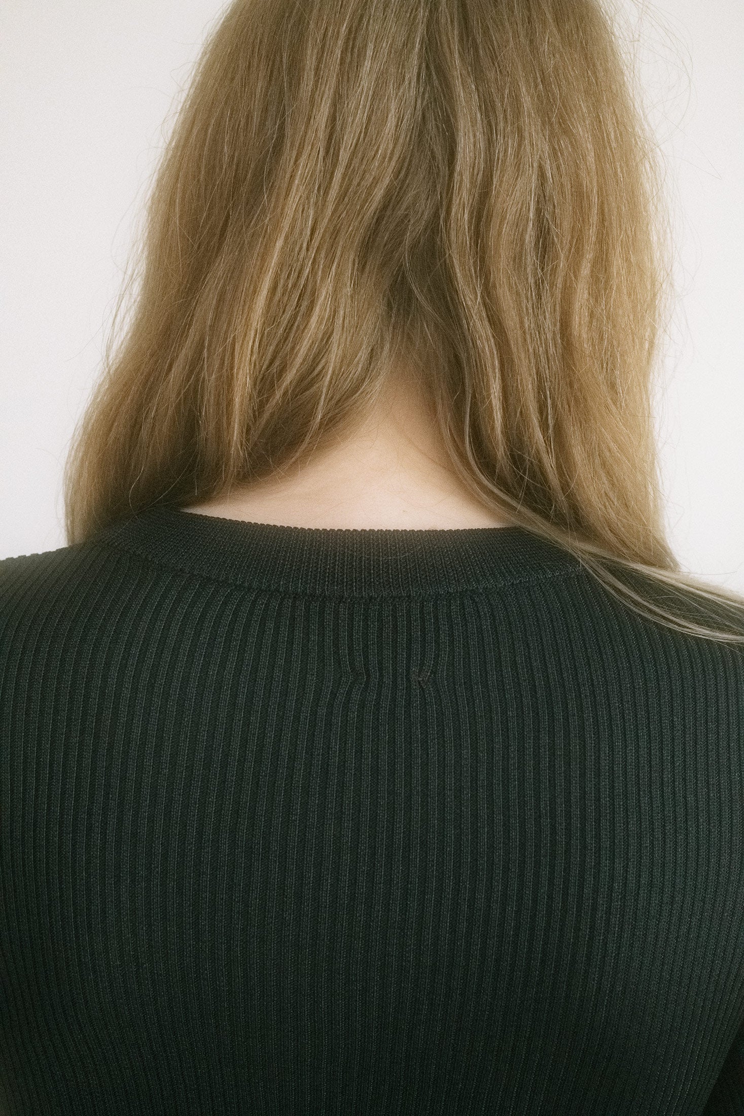 Slightly cropped and black with a subtle sheen, it effortlessly balances between shadow and light, restraint and seduction.