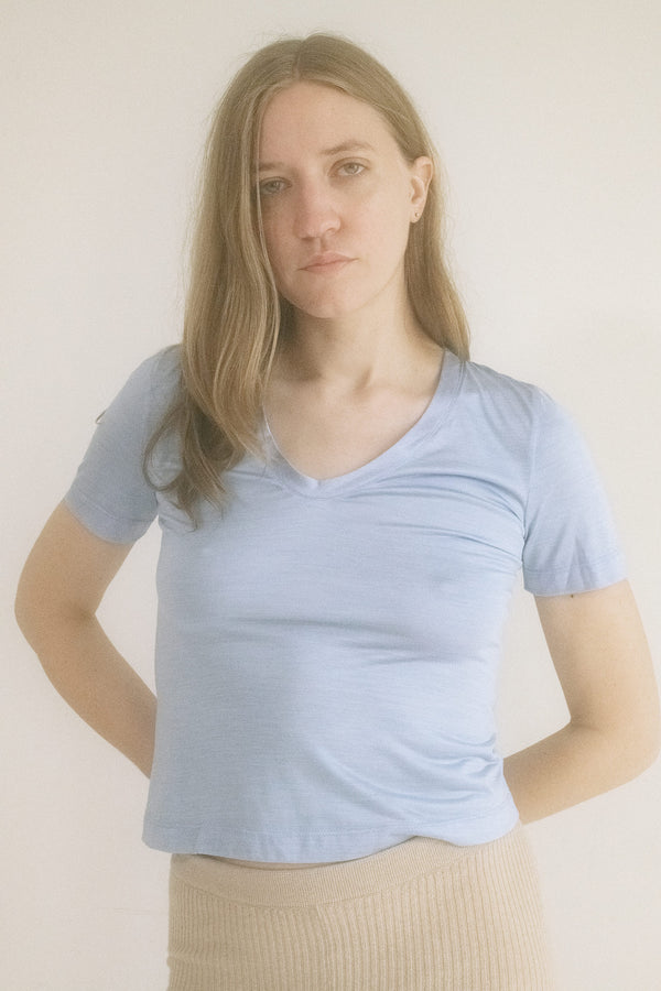 From Judy Turner’s New York atelier, this V-neck tee is pure effortless seduction in a heather powder blue haze. 
