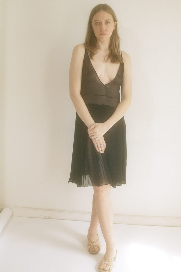 From Judy Turner’s New York atelier, this mini dress is a midnight secret spun from silk chiffon.
