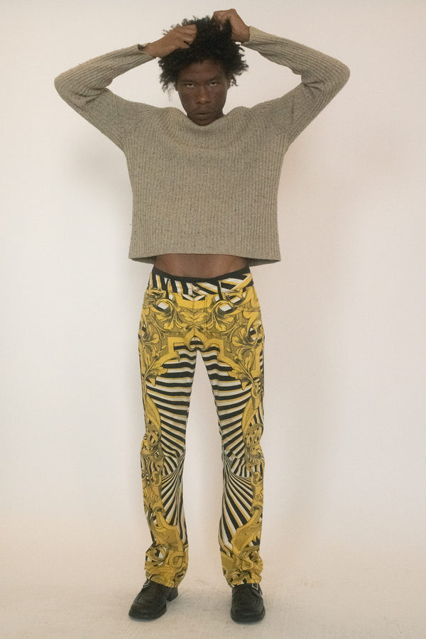Printed denim from Versace, built on spectacle and bravado, its surface carrying the house’s signature pattern in black and yellow like a warning signal.