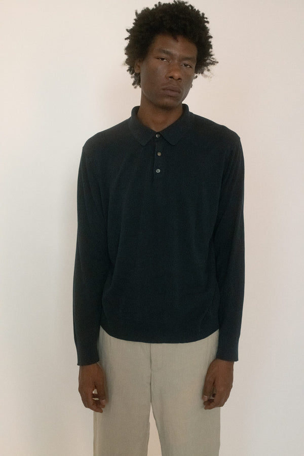 From The Society Archive, a polo with quiet gravity, softened by time. 