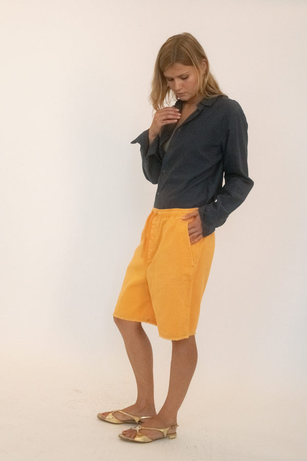 From The Society Archive, a pair of Bermuda shorts by Loewe that feel both utilitarian and unruly.
