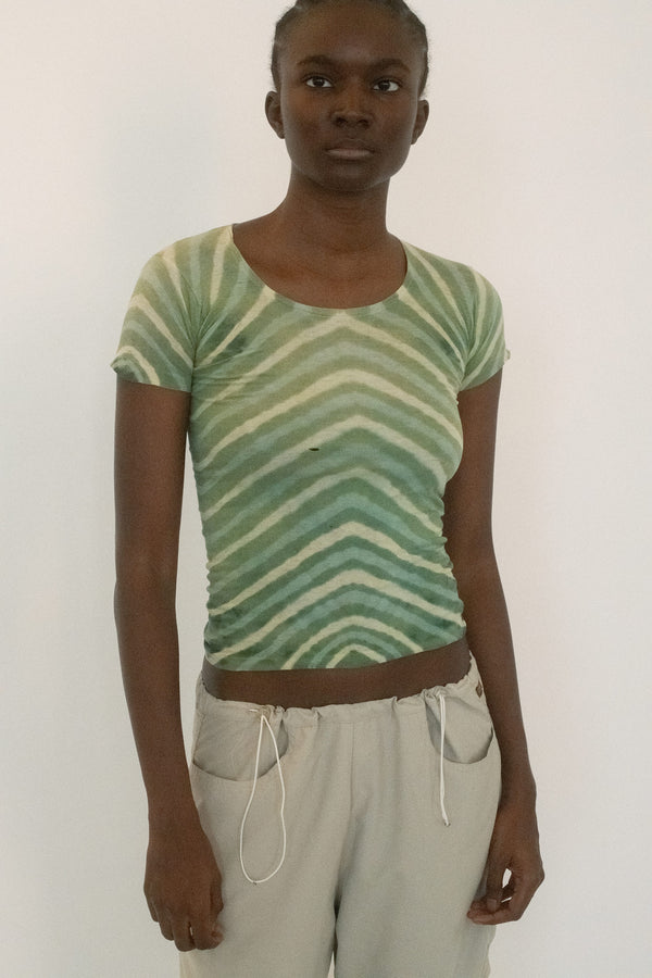 From The Society Archive, a vintage tee that feels like something borrowed straight from a photograph. 