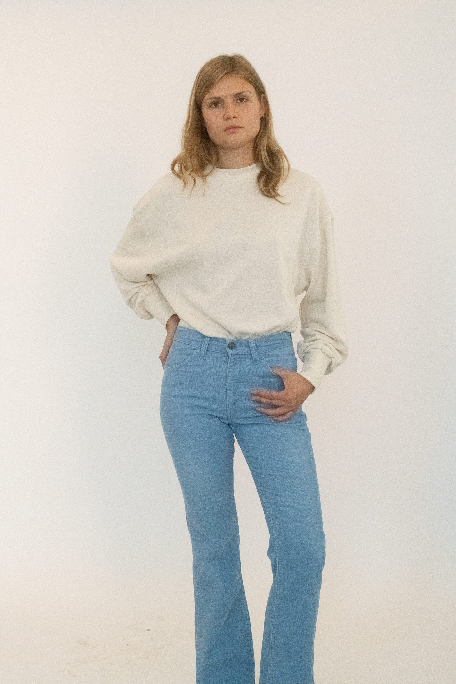 A long-sleeve sweatshirt bodysuit from Stefania. 