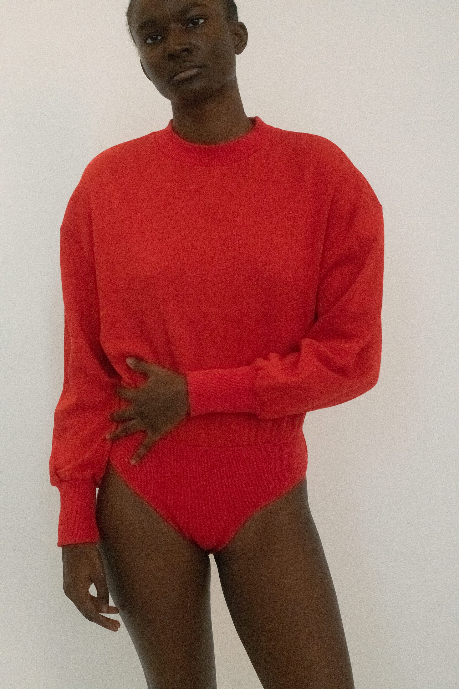 A long-sleeve sweatshirt bodysuit from Stefania. 