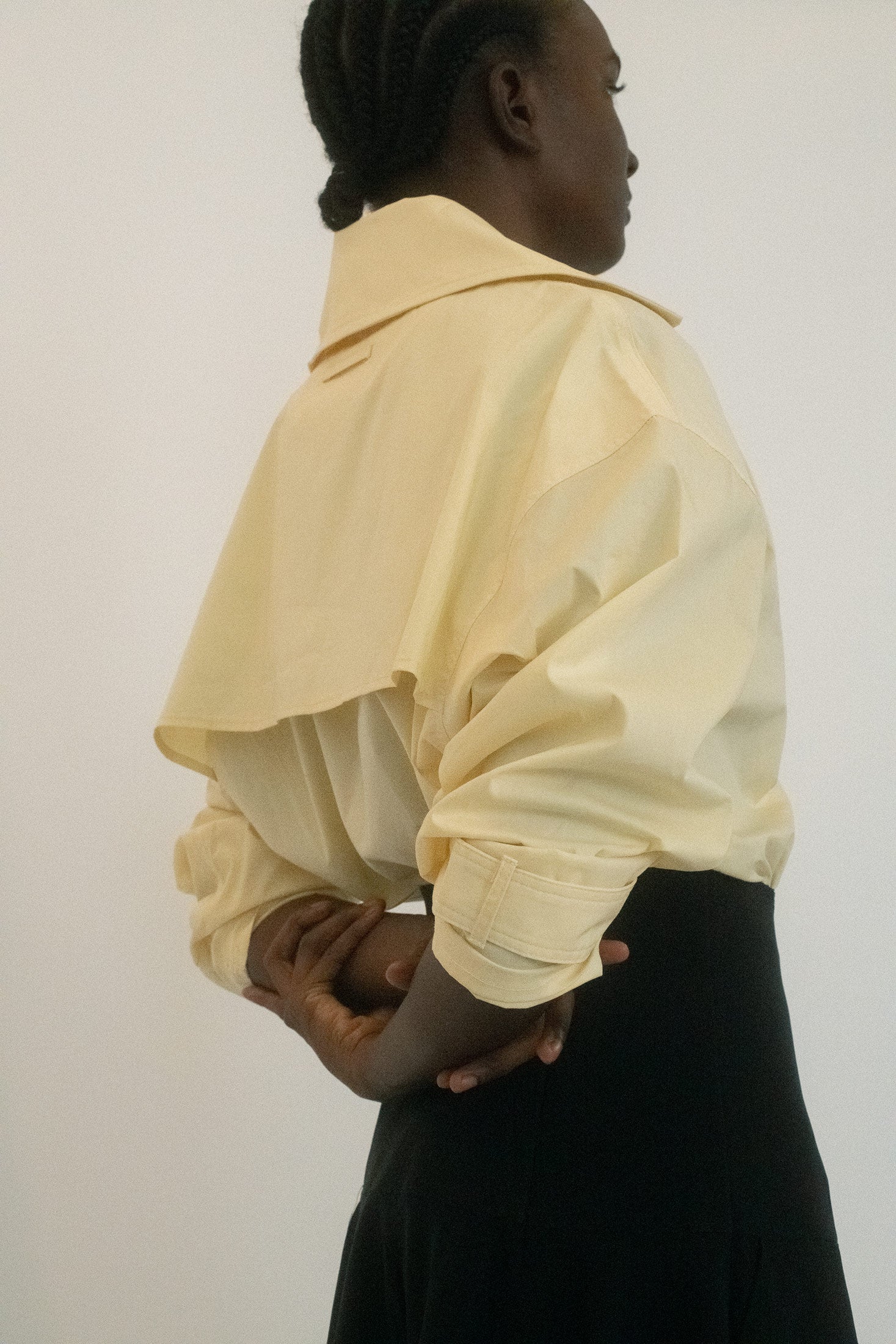 It cinches at the waist just enough to create the illusion of being tucked in - structured, but with an undercurrent of something undone.