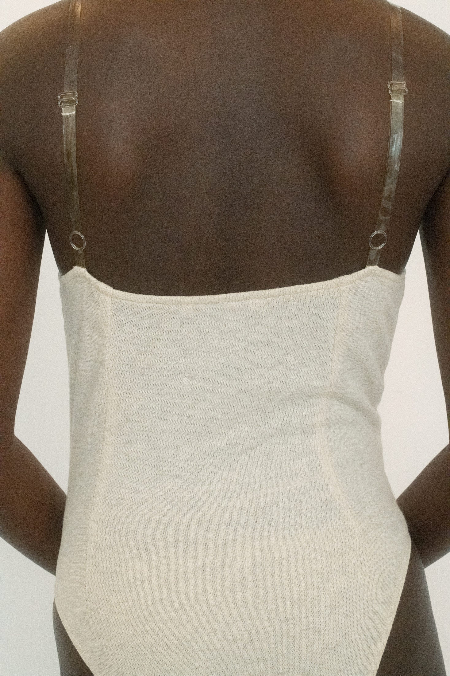 Two silver zips run up the front, gleaming with intent, the kind of detail that suggests both utility and invitation.