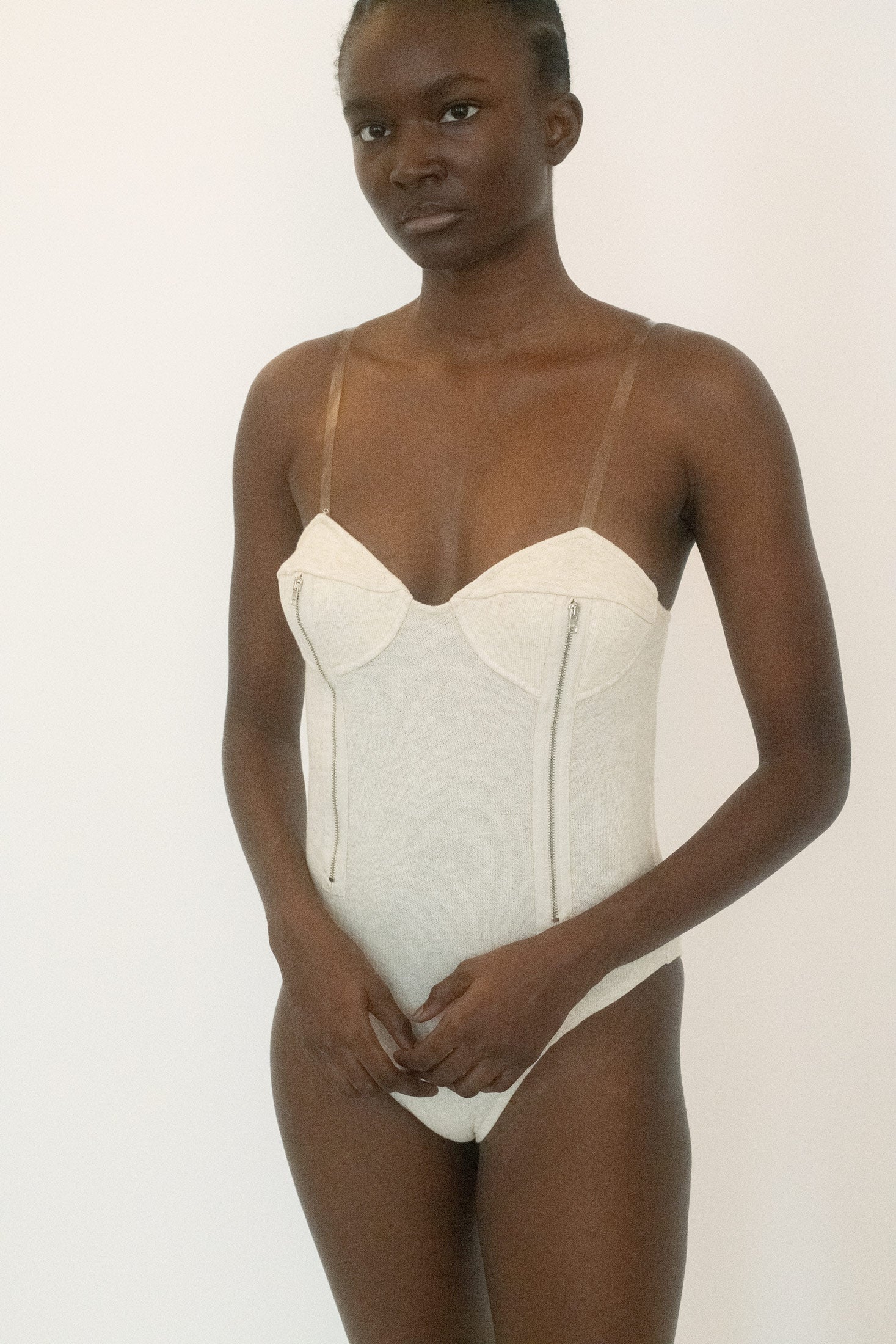 The bustier cut that frames the body like a quiet dare.