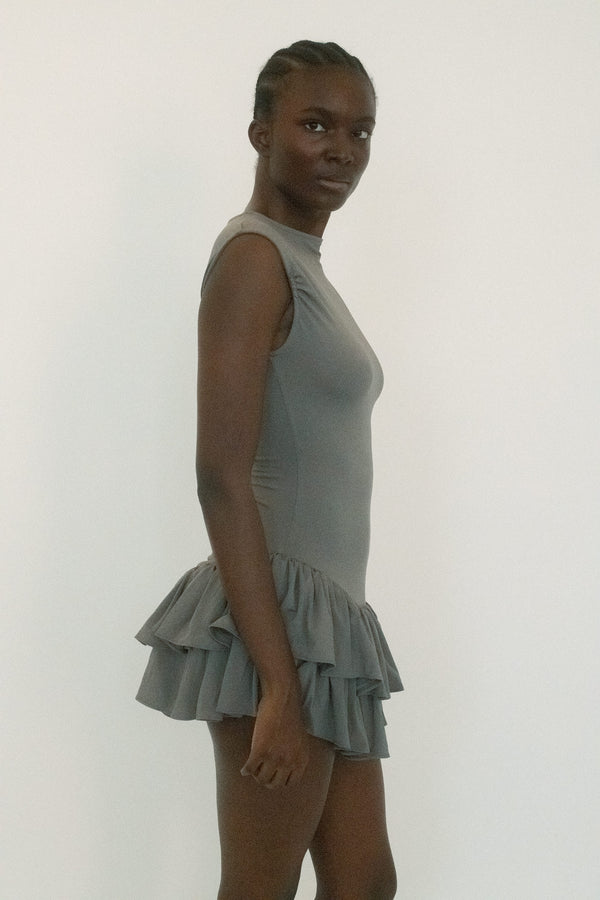 From Belle the Label, a dress that balances structure with tension. 
