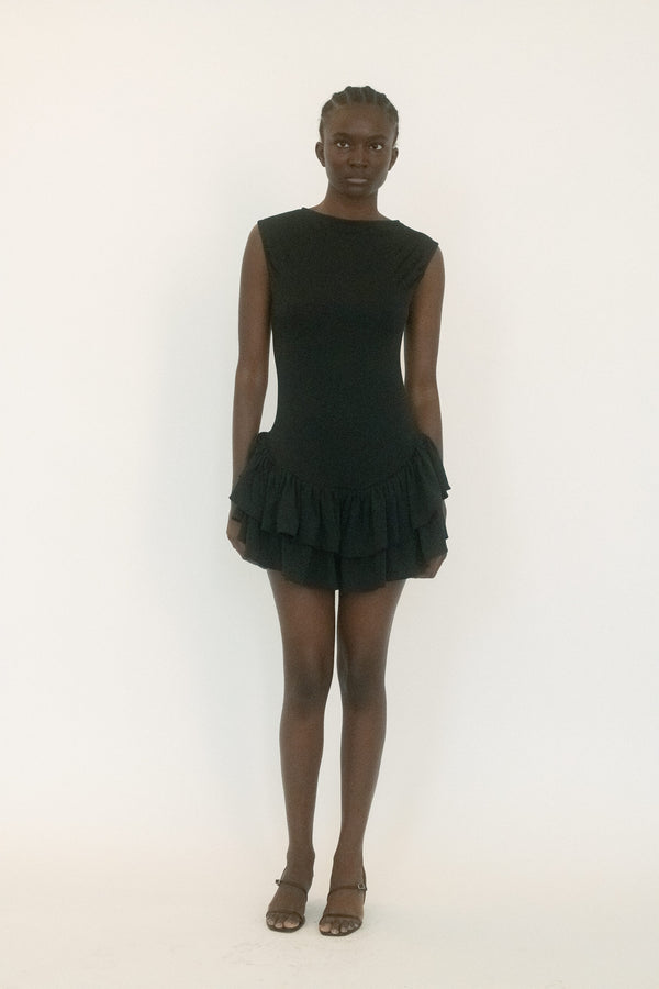 From Belle the Label, a dress that balances structure with tension. 
