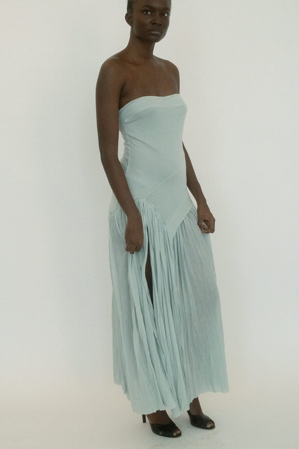 From Belle the Label, a full-length dress with the kind of tension that lingers. 
