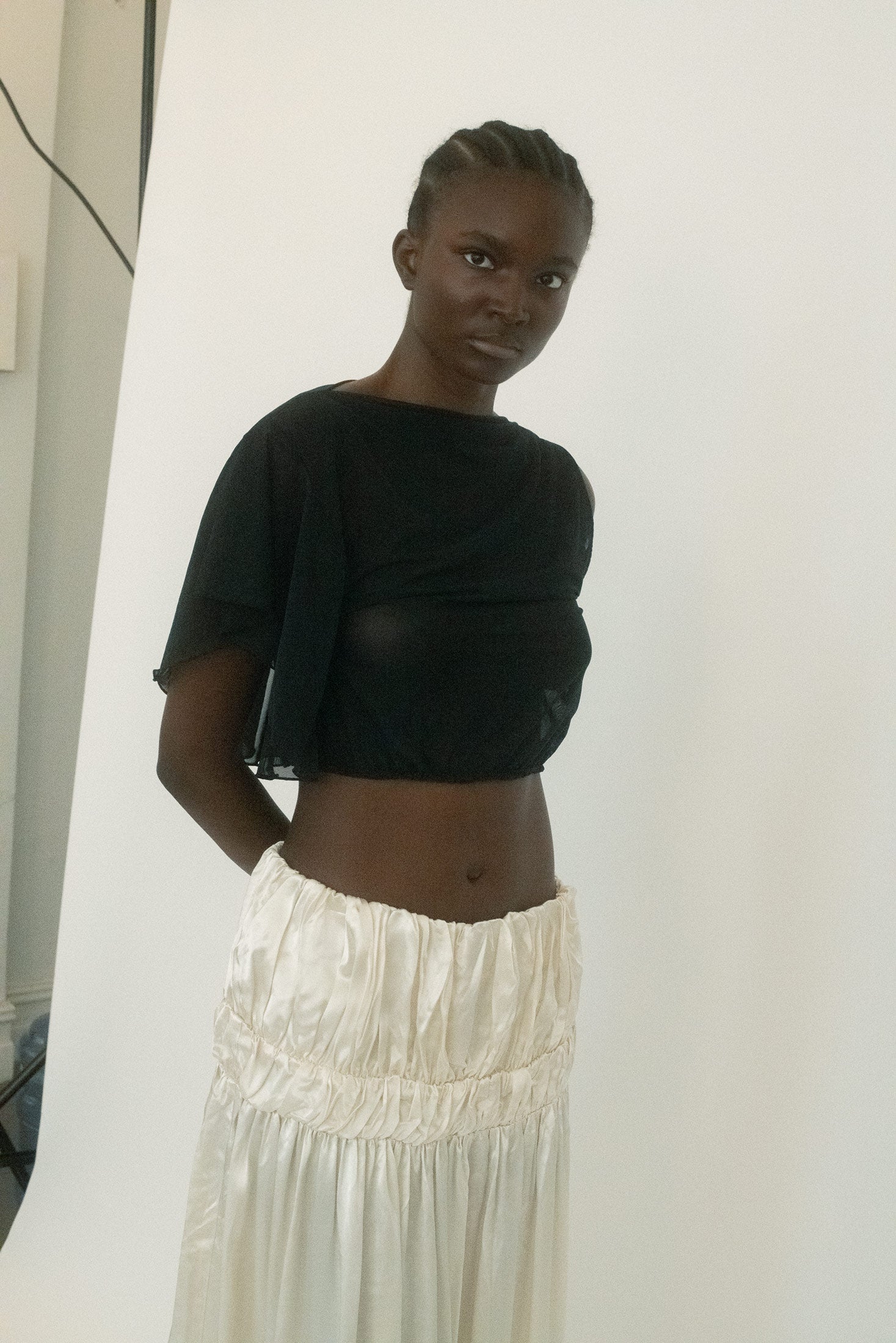 A flexible elastic waistband keeps the fit easy, while a double lining ensures the drape remains sleek and intentional. 