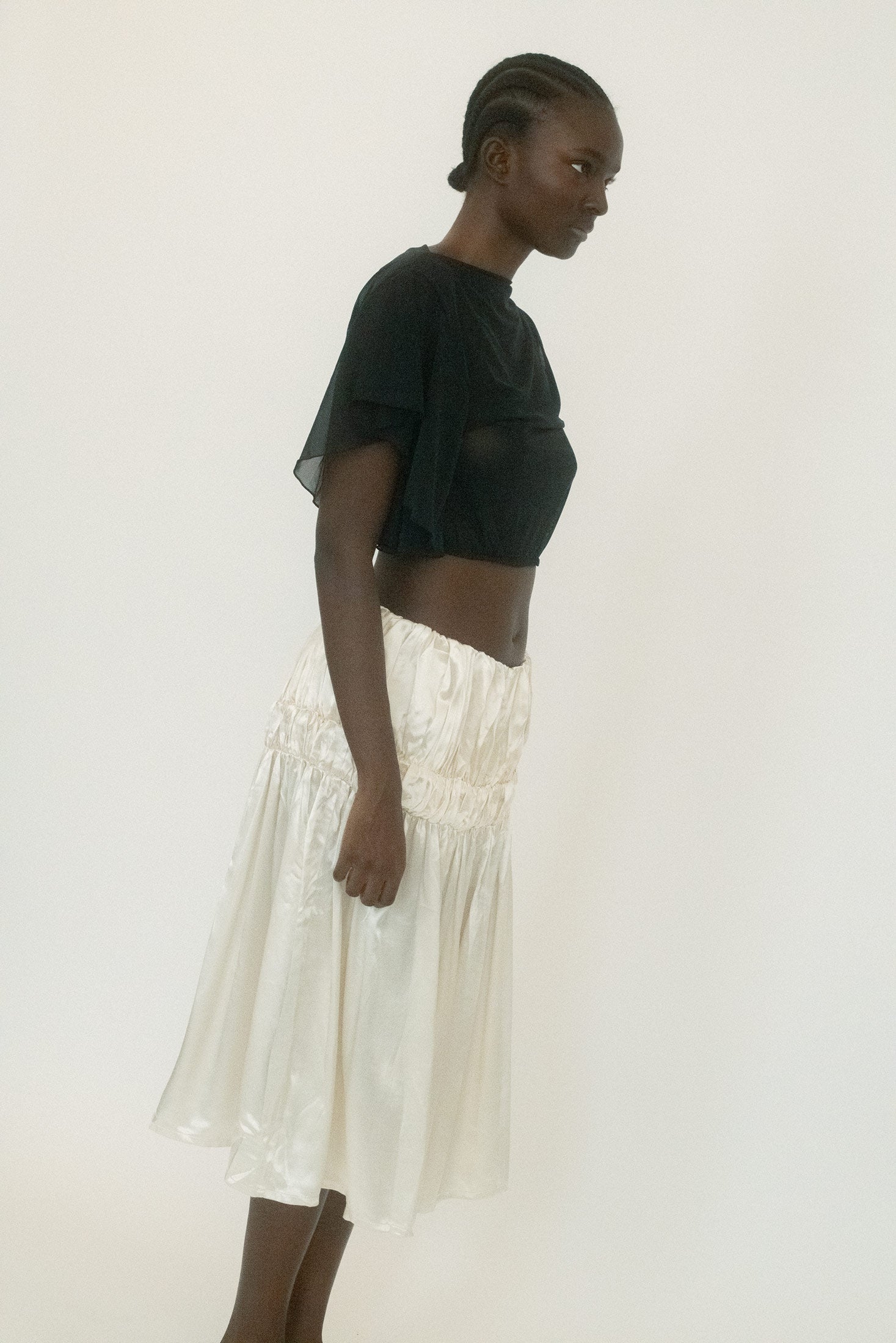 Cut from a slinky viscose and rayon blend, it’s designed to sit mid-rise, falling into a mid-length silhouette that clings and releases in equal measure.