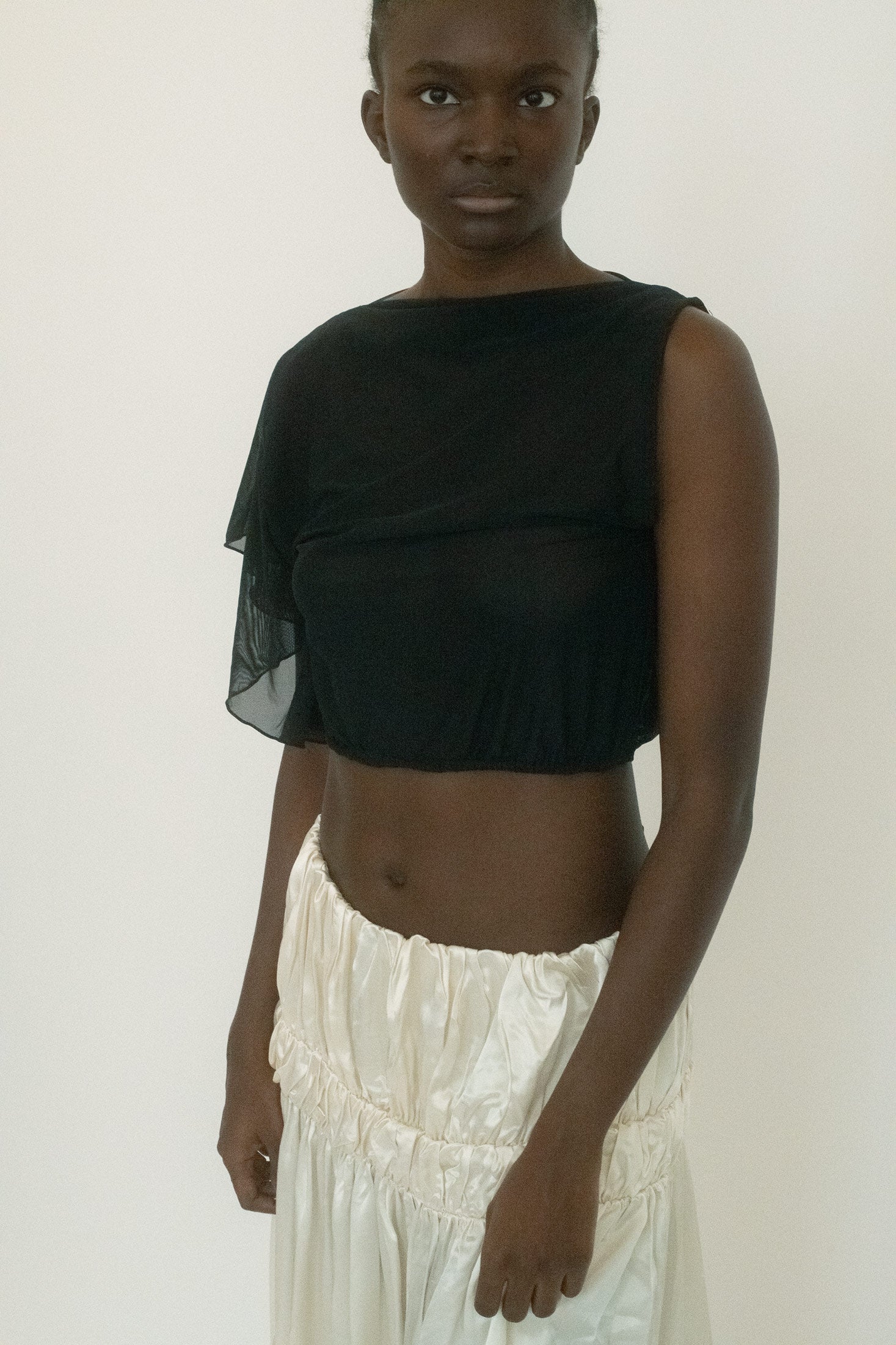 From Belle the Label, a crop top that sharpens softness into something more dangerous. 