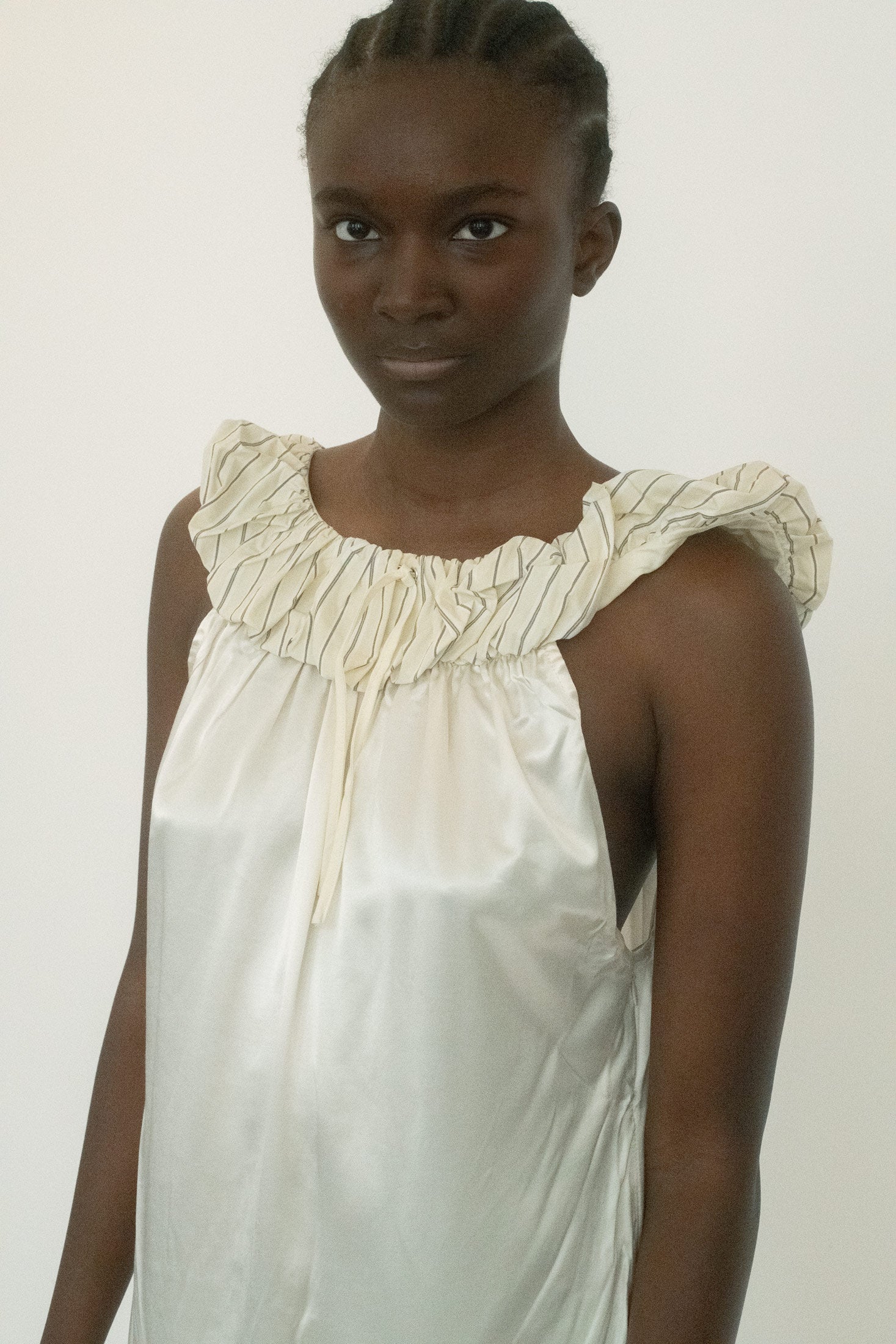 Cut in a midi length with a clean shift silhouette, it floats close to the body without clinging. 