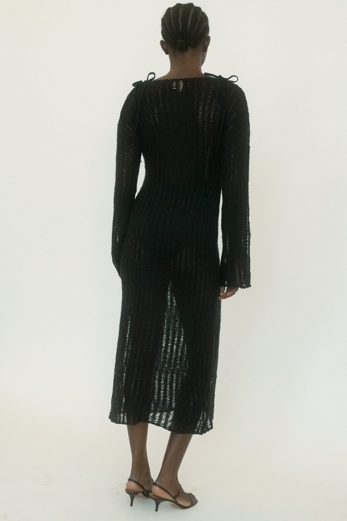  Its silhouette holds close, but the texture is alive: sculptural, tactile, and unmistakably bold. 